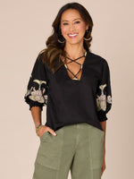 Black Elbow Blouson Sleeve Lace Up V-Neck Die Cut Embroidered Woven Top