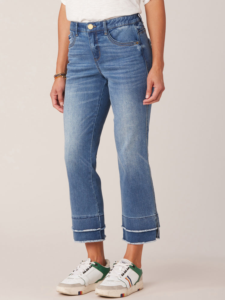 
            
                Load image into Gallery viewer, Mid Blue Denim Absolution Mid Rise Repreve Split Double Layer Fray Kick Flare Hem Jean
            
        