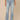 Light Blue Denim Absolution High Rise Slightly Arched Back Yoke Subtle Destruction Petite Out There Flare Jean