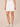 Optic White Denim Absolution High Rise Double Button Tab Patch Pocket 18 Inch Inseam Skirt