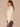 Blanched Almond Long Drop Shoulder Sleeve Mock Neck Patchwork Cable Stitch Design Shirttail Hem Sweater
