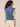 Mid Blue Artisanal Denim Sleeveless Flange Shoulder Button Front Seaming Detail Hidden Seam Pocket Collar Neck Denim Vest