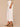 Optic White Denim Absolution Skyrise Angled Dart Seams Four Pocket Patch Back Pockets Cropped Tulip Hem Wide Leg Jean