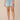 Light Blue Artisanal Denim Ableisure Skyrise Pull-On Drawstring Waist Micro Step Hem Side Slit Petite Relaxed Short