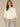 Winter White Three Quarter Dolman Surplus Sleeve Crew Neck Center Seam Mitered Banded Hem Petite Knit Top