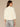 Winter White Three Quarter Dolman Surplus Sleeve Crew Neck Center Seam Mitered Banded Hem Knit Top
