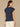Navy Extended Cap Sleeve Scoop Neck Embroidered Pleated Peplum Hem Knit Top