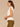 Off White Extended Cap Sleeve Embroidered Scoop Neck Pleated Peplum Hem Knit Top