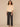 Macadamia Below Elbow Blouson Sleeve Round Neck Half Button Placket Embroidered Front Pleated Back Shirttail Hem Woven Top