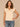 Macadamia Ruffle Cap Sleeve Ruffle Stand Collar Notch Neck Tie Back Pleat Shirttail Hem Knit Top