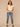 Macadamia Ruffle Cap Sleeve Ruffle Stand Collar Notch Neck Tie Back Pleat Shirttail Hem Knit Top