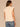 Macadamia Ruffle Cap Sleeve Ruffle Stand Collar Notch Neck Tie Back Pleat Shirttail Hem Knit Top