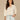 Natural Off White Three Quarter Cinched Blouson Ruffle Sleeve Elastic Cased Stand Collar Notch Neck Half Floral Button Placket Embroidered Mixed Media Woven Top
