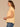 Peach Puree Extended Short Sleeve Rounded Ruffle Collar Neck Button Down Front Straight Back Yoke Textured Dot Hi-Low Shirttail Hem Woven Top