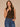 Black Camel Sleeveless Cowl Neck Zip Back Abstract Animal Print Slit Shirttail Hem Woven Top
