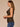 Black Camel Sleeveless Cowl Neck Zip Back Abstract Animal Print Slit Shirttail Hem Woven Top