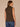 Black Camel Sleeveless Cowl Neck Zip Back Abstract Animal Print Slit Shirttail Hem Woven Top