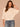 Heather Cream Three Quarter Dolman Sleeve High V-Neck Front Embroidery Back Center Seam Banded Hem Knit Top