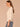 Heather Cream Three Quarter Dolman Sleeve High V-Neck Front Embroidery Back Center Seam Banded Hem Knit Top