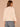 Heather Cream Three Quarter Dolman Sleeve High V-Neck Front Embroidery Back Center Seam Banded Hem Knit Top