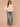 Heather Cream Three Quarter Dolman Sleeve High V-Neck Front Embroidery Back Center Seam Banded Hem Knit Top