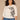 Off White Black Three Quarter Drop Shoulder Dolman Sleeve Scoop Neck Back Center Seam Floral Embroidery Shirttail Hem Plus Size Knit Top
